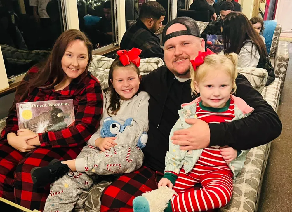 Joey and his family in Christmas pajamas
