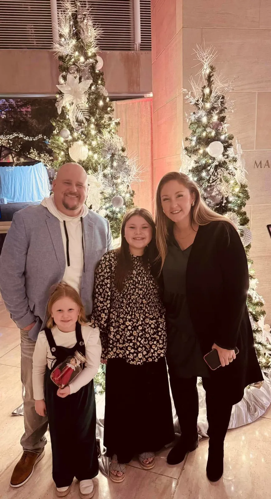 Joey with his wife and two daughters at Christmas