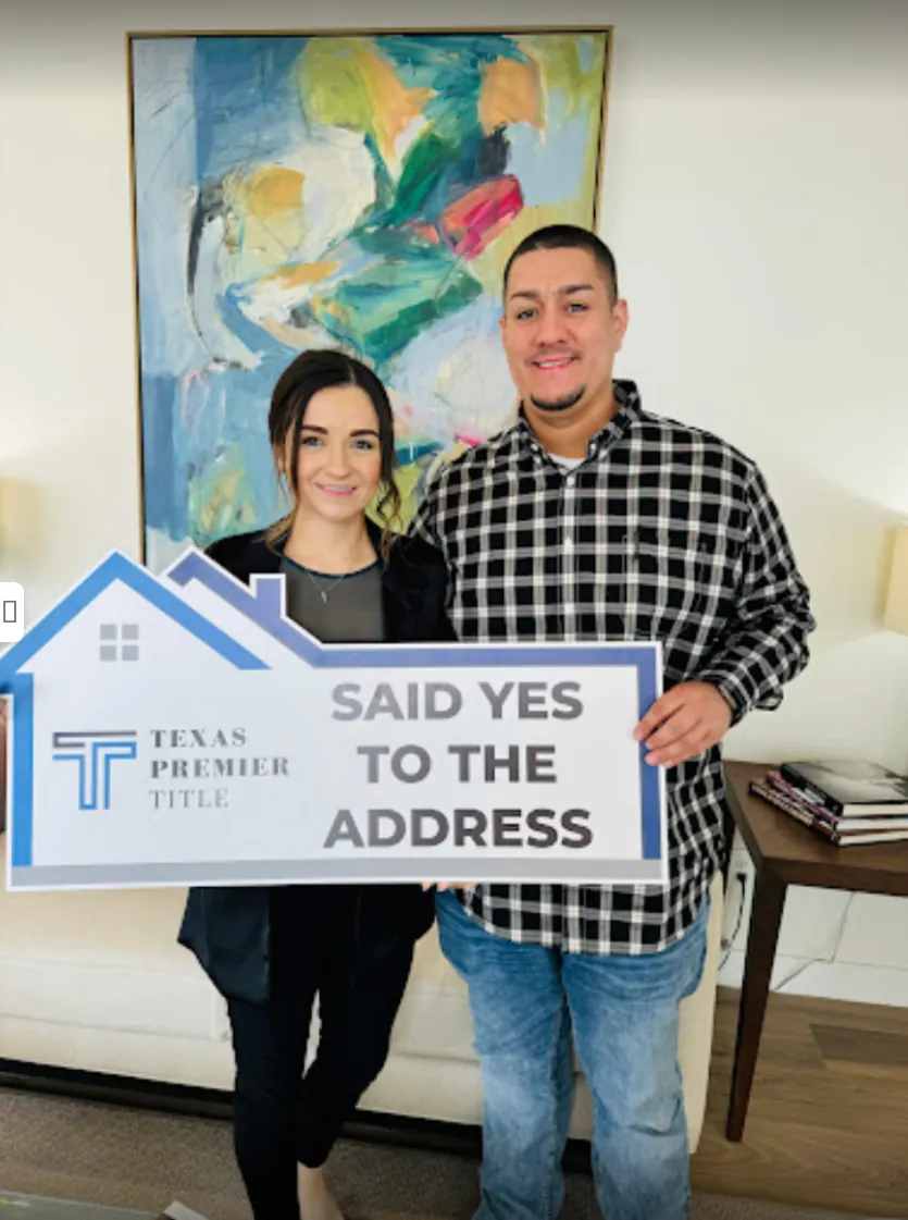 Vivian James with a Said Yes to the Address sign